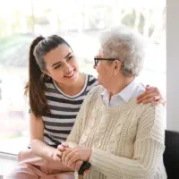 A female and a senior woman looking at each other
