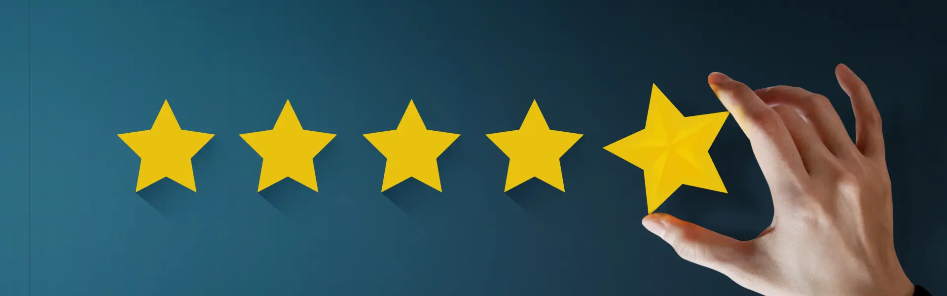 A hand putting stars